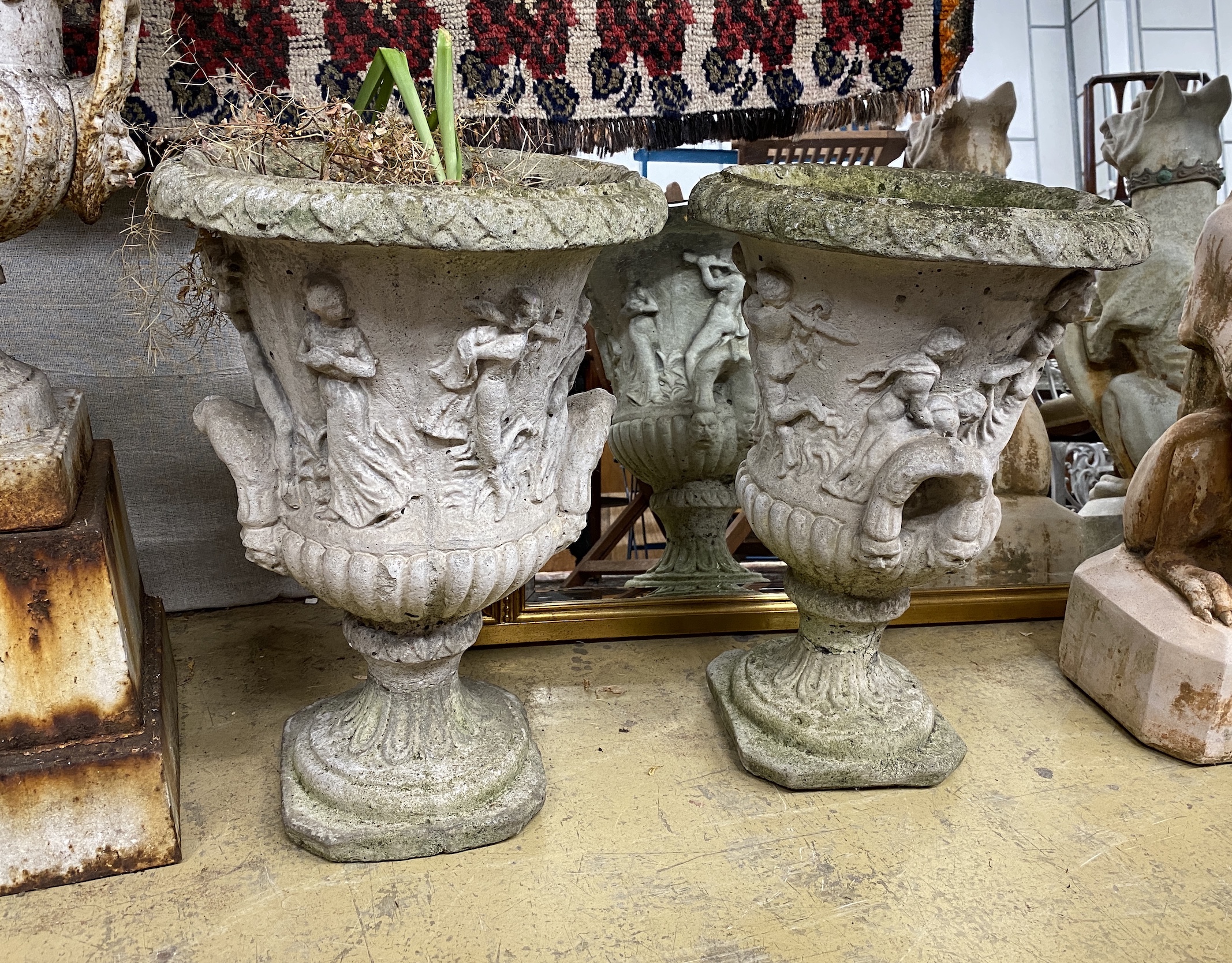 A pair of reconstituted stone campana garden urns, diameter 38cm, height 56cm
